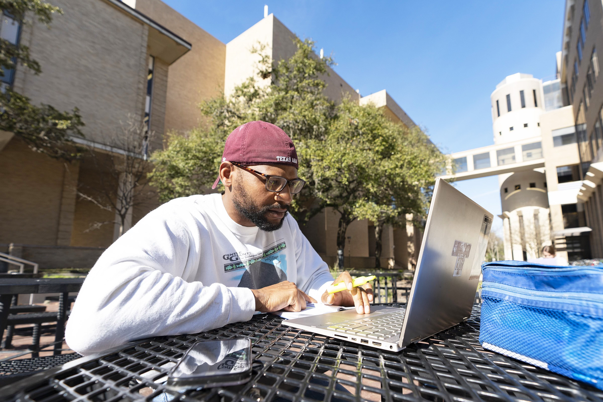 tamu student with a laptop